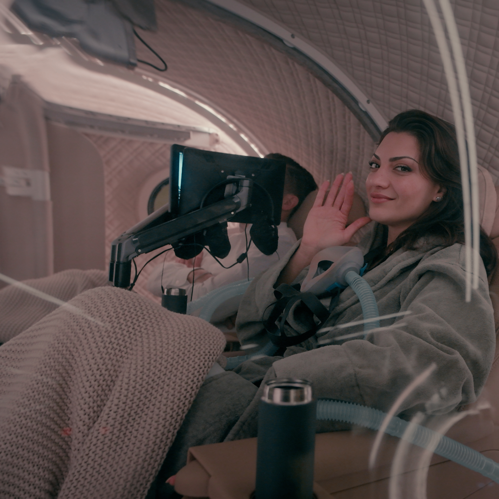 Client waving from HBOT chamber